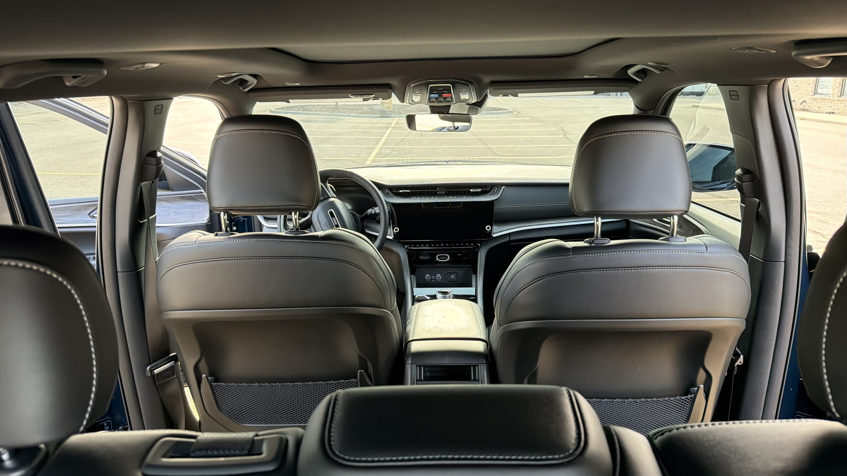 2026 Jeep Grand Cherokee Limited — Cockpit & infotainment from rear seating
